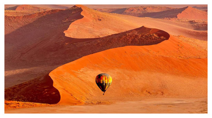 A scenic hot air balloon ride over the Namib desert’s endless sand dunes